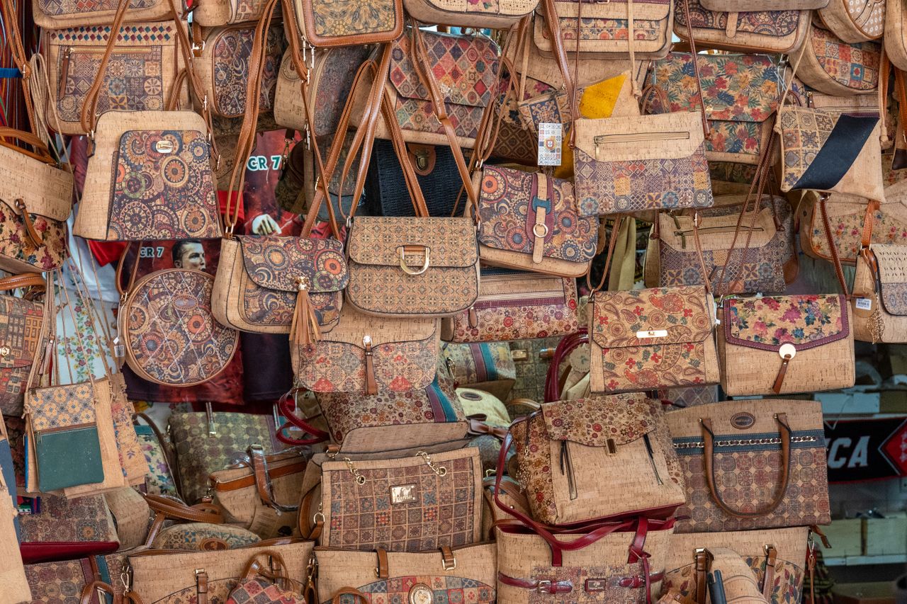 Crafting Captivating Headlines: Your awesome post title goes here Vibrant selection of handmade patterned bags showcasing intricate designs at a local market.